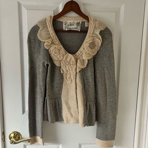 Anthropologie sweater in grey with cream rosettes and detailing. Size small.